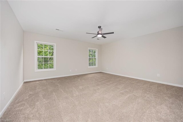 3510 Meadow Glen Ct, Clemmons, NC 27012 - carpeted spare room featuring ceiling fan, baseboards, and visible vents