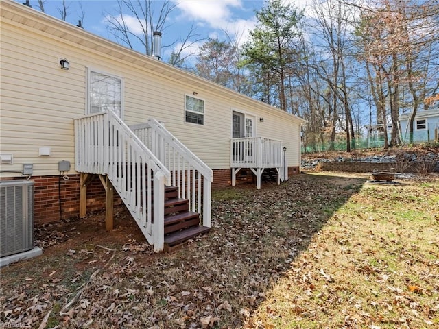 rear view of property with central air condition unit