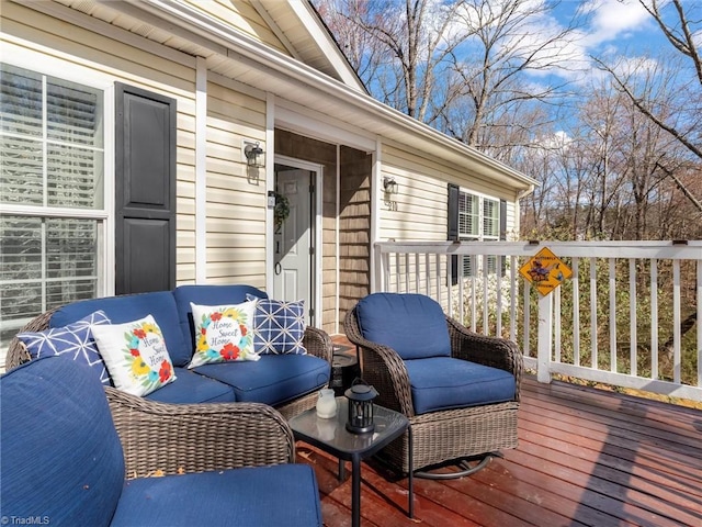 wooden terrace featuring an outdoor hangout area