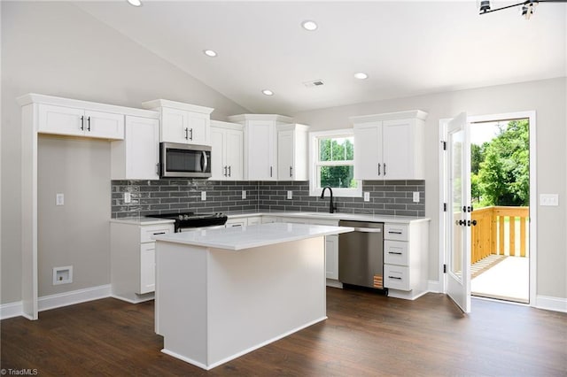 3902 NC Highway 47, Lexington, NC 27292 - kitchen featuring appliances with stainless steel finishes, backsplash, light countertops, white cabinetry, and recessed lighting