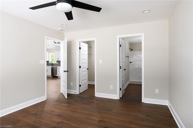 3902 NC Highway 47, Lexington, NC 27292 - unfurnished bedroom featuring a spacious closet, dark wood-style flooring, ensuite bath, recessed lighting, and a closet