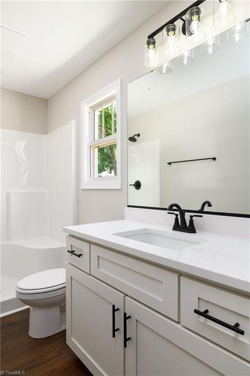 3902 NC Highway 47, Lexington, NC 27292 - full bathroom featuring vanity, a shower, and wood finished floors