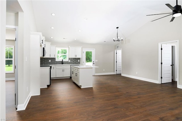 3902 NC Highway 47, Lexington, NC 27292 - kitchen featuring a ceiling fan, decorative backsplash, a kitchen island, recessed lighting, and dark wood-style flooring