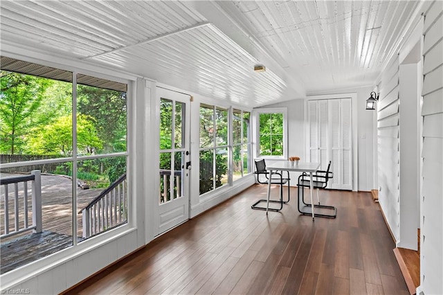 sunroom with healthy amount of natural light and hardwood / wood-style floors