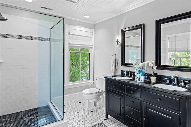 full bath with a stall shower, healthy amount of natural light, toilet, tile patterned floors, and crown molding
