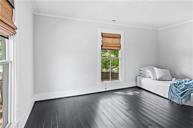 unfurnished bedroom featuring dark wood-style flooring, crown molding, multiple windows, and baseboards