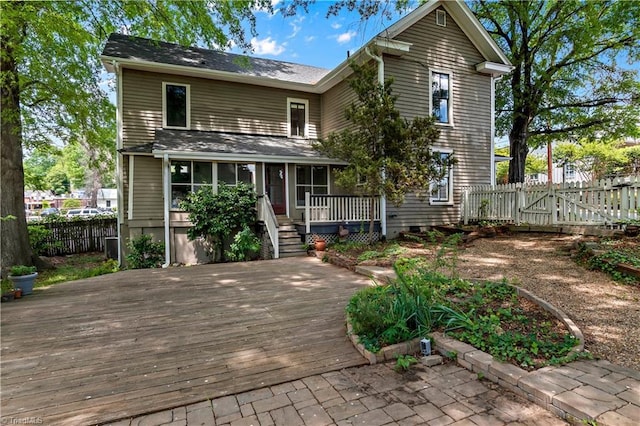 view of front of home featuring a deck and a fenced backyard