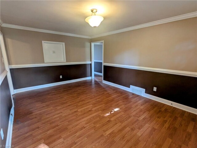 5675 Main St, Bethania, NC 27040 - unfurnished room with wood finished floors and ornamental molding