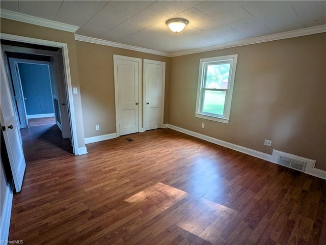 5675 Main St, Bethania, NC 27040 - unfurnished bedroom featuring wood finished floors, crown molding, and a closet