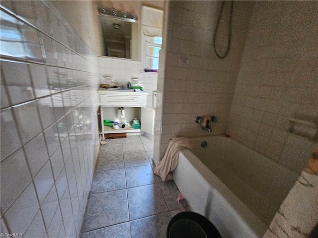 bathroom with tile walls, tile patterned flooring, and shower / bathtub combination