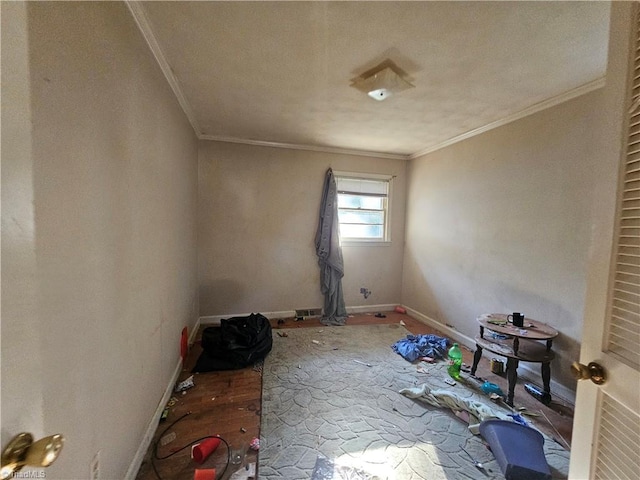 empty room featuring crown molding