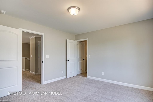 unfurnished bedroom with light colored carpet