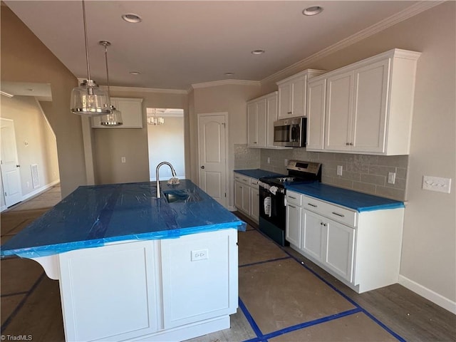 kitchen with white cabinetry, appliances with stainless steel finishes, sink, and a center island with sink