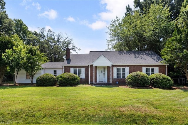1425 Union Cross Rd, Kernersville, NC 27284 - view of front of property featuring a front lawn, a chimney, and brick siding