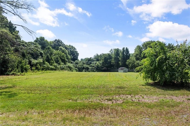 1425 Union Cross Rd, Kernersville, NC 27284 - view of green lawn featuring a view of trees, a rural view, and a shed