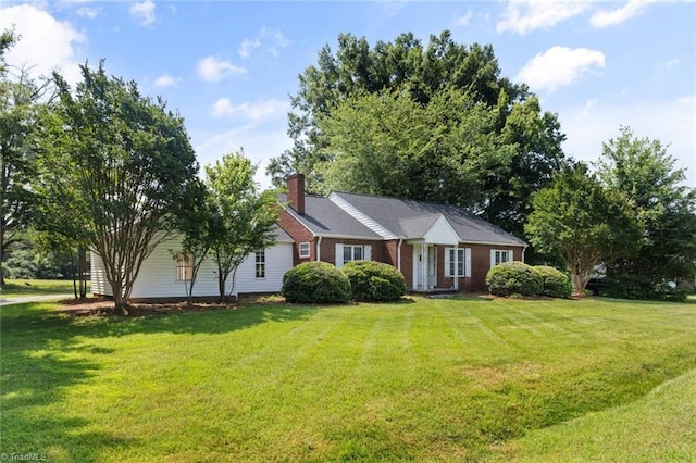 1425 Union Cross Rd, Kernersville, NC 27284 - view of front facade with a chimney, a front yard, and brick siding