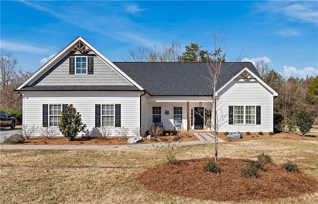 view of front of home featuring a porch and a front yard