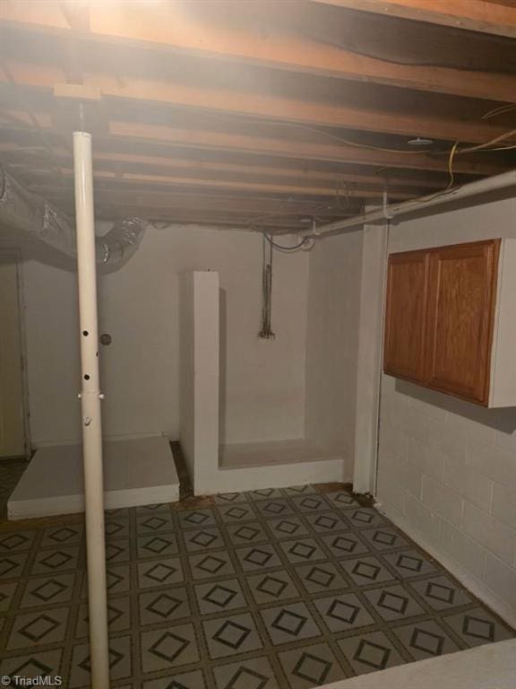 unfinished below grade area featuring tile patterned floors