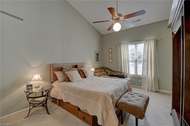 bedroom featuring visible vents, baseboards, lofted ceiling, a textured ceiling, and light colored carpet