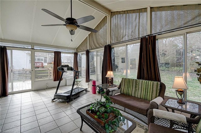 sunroom / solarium with vaulted ceiling with beams and a ceiling fan