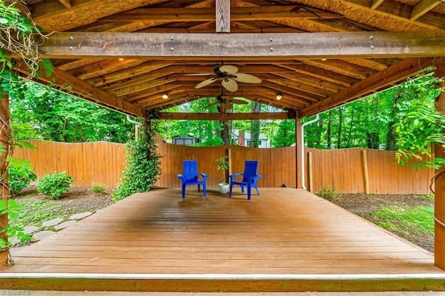 wooden deck featuring a ceiling fan, a gazebo, and a fenced backyard