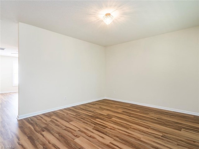 1307 Montreux Ct, Mebane, NC 27302 - spare room featuring visible vents, wood finished floors, and baseboards