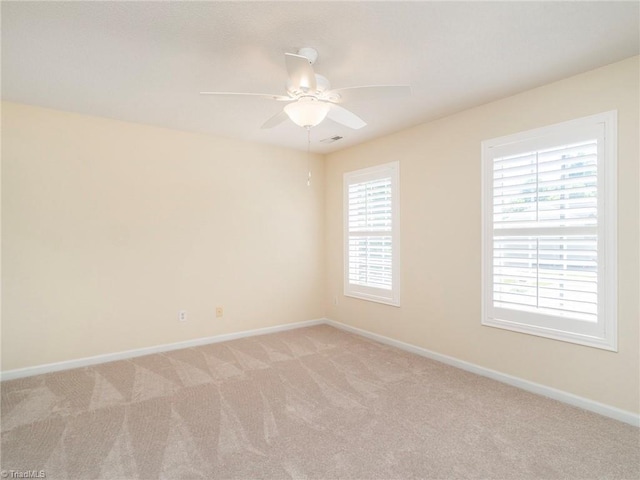 1307 Montreux Ct, Mebane, NC 27302 - empty room featuring ceiling fan, light carpet, and baseboards