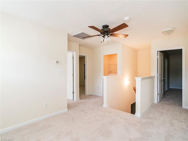 1307 Montreux Ct, Mebane, NC 27302 - carpeted empty room featuring baseboards, a ceiling fan, and visible vents