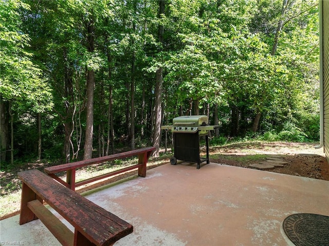 1307 Montreux Ct, Mebane, NC 27302 - surrounding community with a patio and a forest view