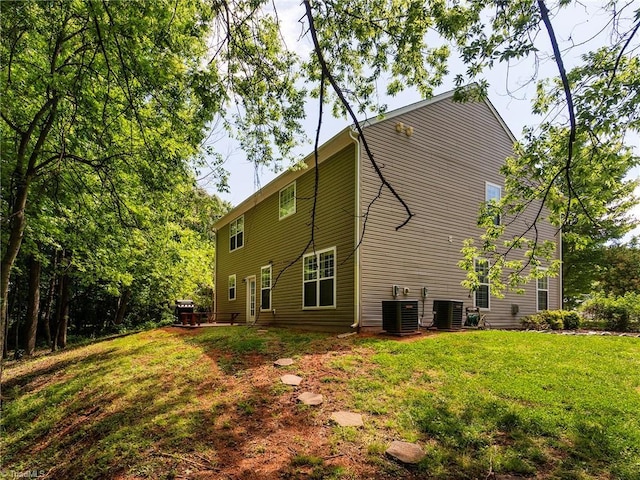 1307 Montreux Ct, Mebane, NC 27302 - back of property with a lawn and central AC