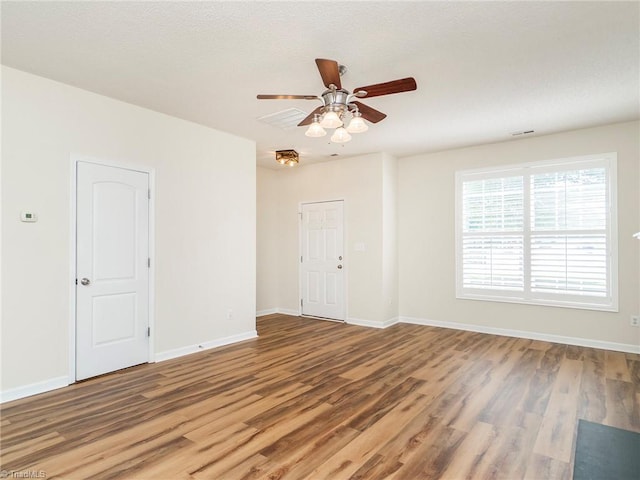 1307 Montreux Ct, Mebane, NC 27302 - spare room featuring baseboards, ceiling fan, and wood finished floors