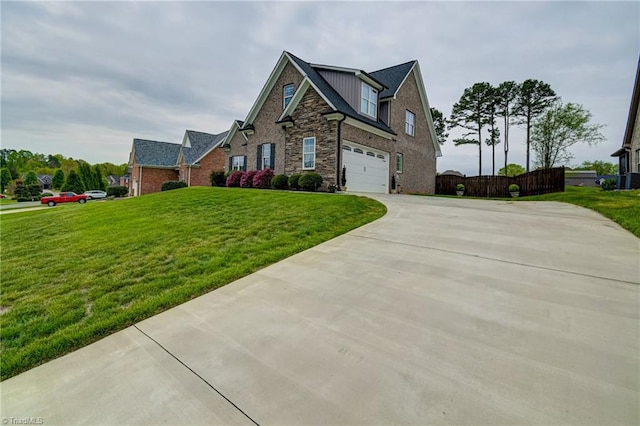 231 Plumstead Ln, Clemmons, NC 27012 - view of front facade featuring concrete driveway, a garage, brick siding, and stone siding