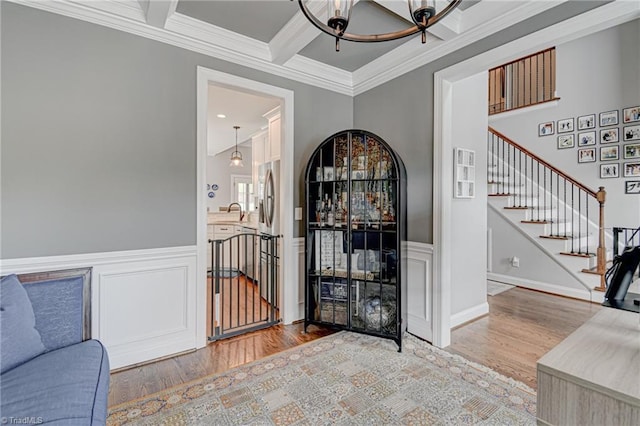 231 Plumstead Ln, Clemmons, NC 27012 - interior space featuring wood finished floors, ornamental molding, stairway, coffered ceiling, and beam ceiling
