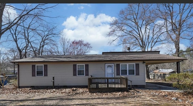 view of front of house featuring an attached carport and crawl space