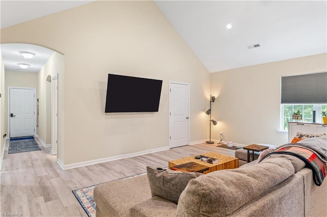 301 Valley Dr, High Point, NC 27260 - living area featuring arched walkways, high vaulted ceiling, and light wood-style floors
