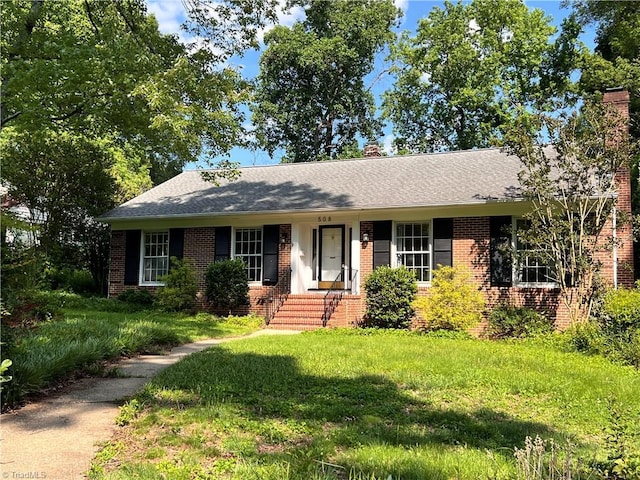 508 Audubon Dr, Greensboro, NC 27410 - ranch-style house with brick siding and a chimney
