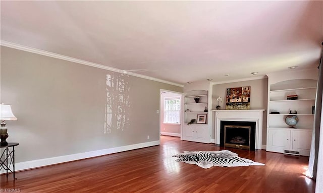 508 Audubon Dr, Greensboro, NC 27410 - living area with wood finished floors, ornamental molding, built in shelves, and a fireplace