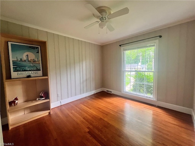 508 Audubon Dr, Greensboro, NC 27410 - unfurnished room with crown molding, wood finished floors, and ceiling fan