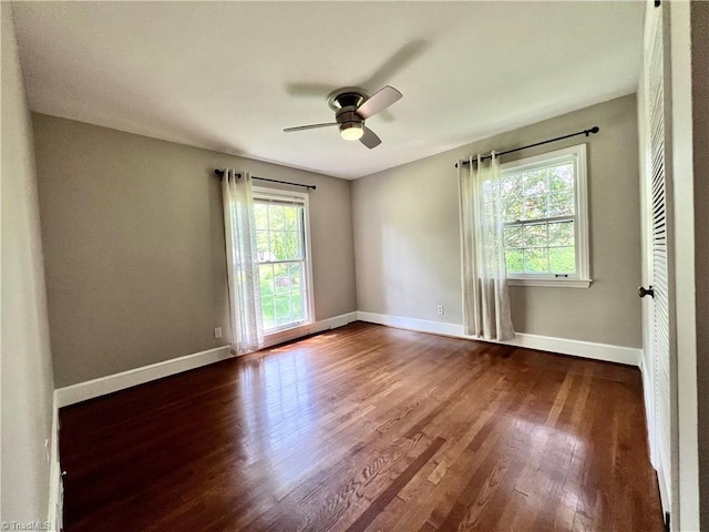 508 Audubon Dr, Greensboro, NC 27410 - empty room with dark wood-style floors and ceiling fan