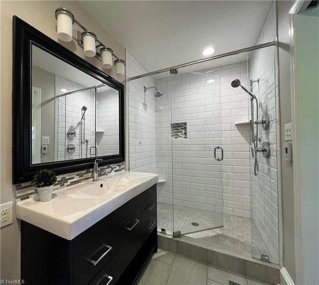 508 Audubon Dr, Greensboro, NC 27410 - full bathroom featuring a stall shower, vanity, tile patterned floors, and recessed lighting