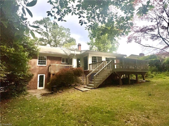 508 Audubon Dr, Greensboro, NC 27410 - rear view of property with stairs, brick siding, a wooden deck, and a yard