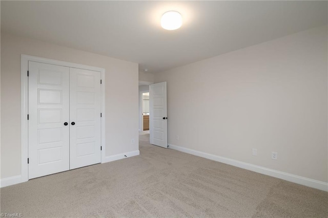 1815 Cleburne Ter, Kernersville, NC 27284 - unfurnished bedroom with carpet floors, a closet, and baseboards