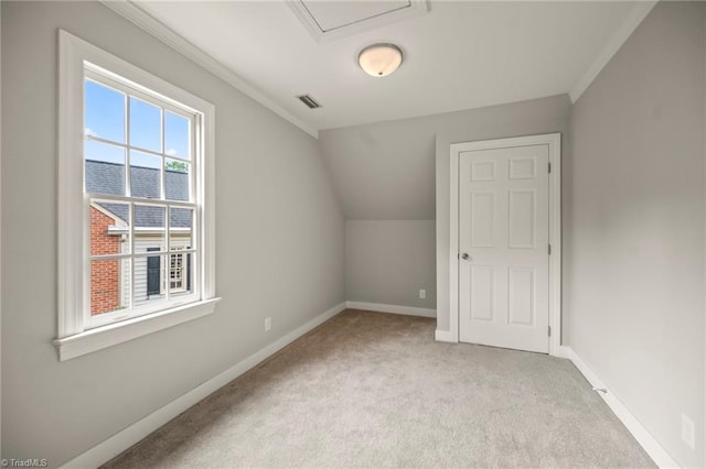 bonus room featuring carpet flooring, visible vents, lofted ceiling, and baseboards