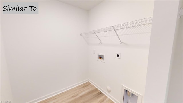 laundry room featuring washer hookup, hookup for an electric dryer, gas dryer hookup, and hardwood / wood-style floors