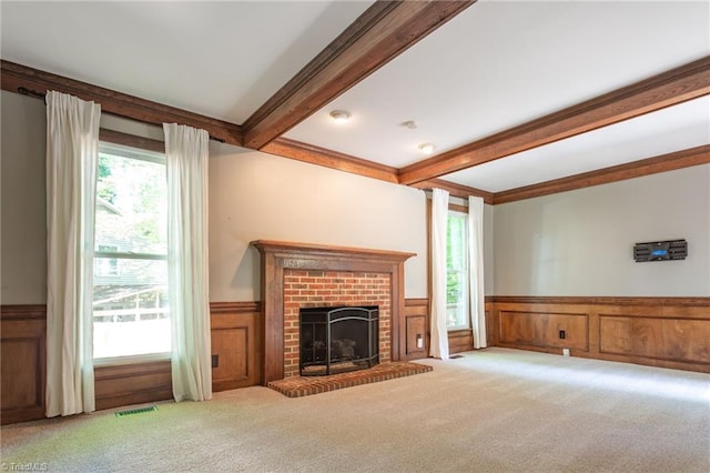 4602 Forest Glen Rd, Greensboro, NC 27410 - unfurnished living room with a wainscoted wall, beamed ceiling, carpet, and plenty of natural light