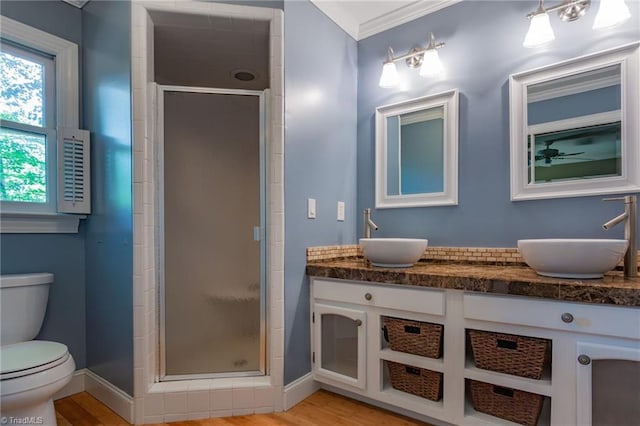 4602 Forest Glen Rd, Greensboro, NC 27410 - full bath with toilet, a shower stall, double vanity, baseboards, and crown molding