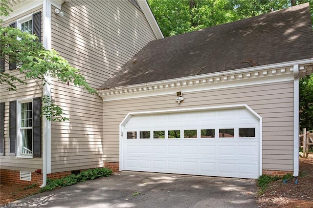 4602 Forest Glen Rd, Greensboro, NC 27410 - garage with asphalt driveway