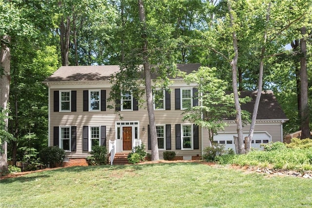 4602 Forest Glen Rd, Greensboro, NC 27410 - colonial house featuring a front lawn
