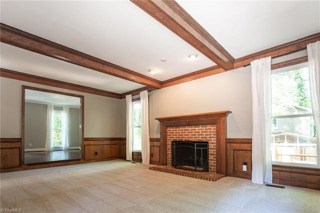 4602 Forest Glen Rd, Greensboro, NC 27410 - unfurnished living room featuring wainscoting, beamed ceiling, carpet floors, and a brick fireplace