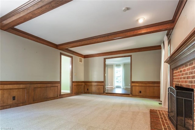4602 Forest Glen Rd, Greensboro, NC 27410 - unfurnished living room with wainscoting, beamed ceiling, a fireplace, carpet, and crown molding